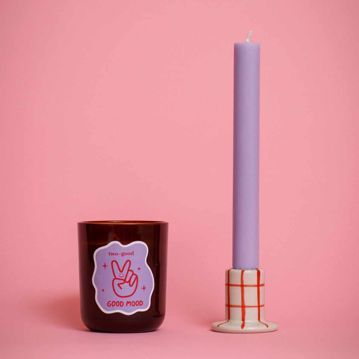 two~good Good Mood candle lit at home