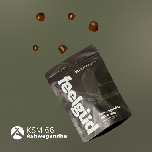 feelingud Ashwagandha gummies packaging with scattered gummies on a dark green background